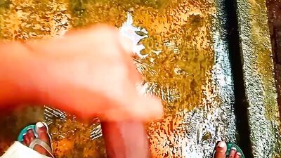 Close-up footage of a chap playing with his tiny pecker