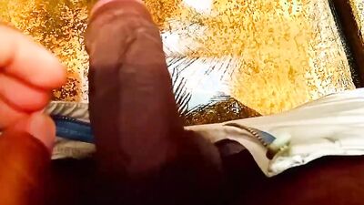 Close-up footage of a chap playing with his tiny pecker