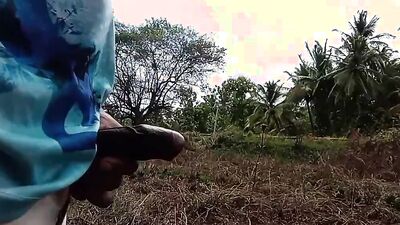 Amateur lad strokes his hard pecker out in the open
