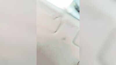 Lad plays with his hard prick while smoking and driving