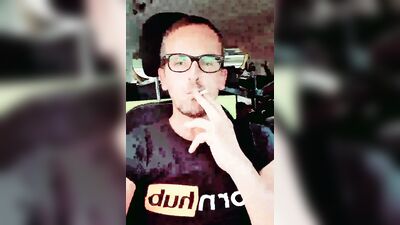 Lad plays with his hard prick while smoking and driving