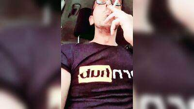 Lad plays with his hard prick while smoking and driving