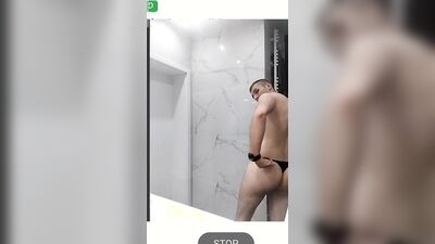Young college guy having fun in the shower