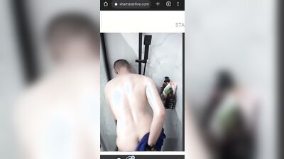 Young college guy having fun in the shower