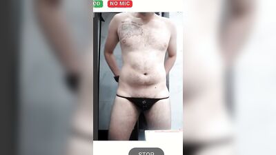 Young college guy having fun in the shower
