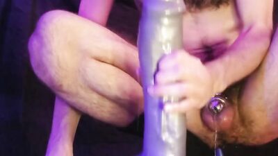 Oozing buckets in chastity from huge anal dildos and plug