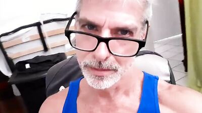 Richard Lennox strokes his big cock in the office