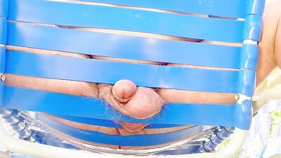 Grandpa cums secretly in his lounge chair next to others
