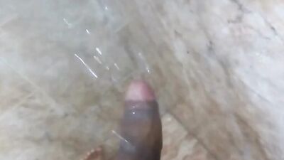 muscled man jerks off under the shower water, shows and massages his huge, hard cock until cumming, his milk is delicius