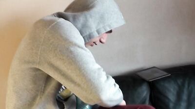 Cute gay guy passes the time with erotic masturbation until he comes to cum