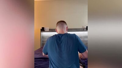 Coach helps guy with his back pain by stretching him out