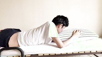 Perverted Japanese boys rubbing their cocks on the bed.