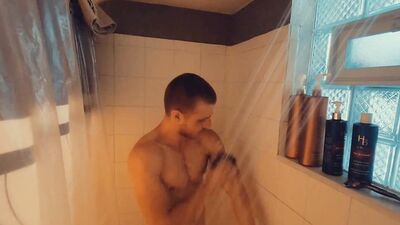 Redhead amateur edges his partially hard cock and moans for you after taking a shower