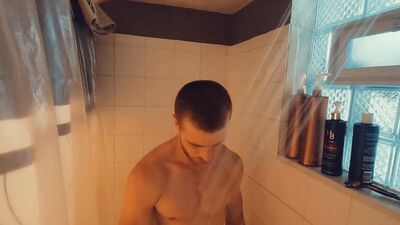 Redhead amateur edges his partially hard cock and moans for you after taking a shower