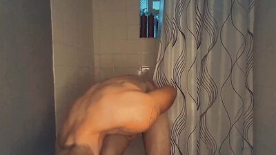 Redhead amateur edges his partially hard cock and moans for you after taking a shower