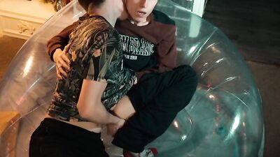 Two sweet guys share an inflatable chair