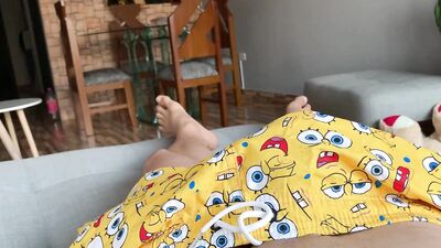 Hot latin guy jerk off in the couch POV till he cums wearing spongebob's pants