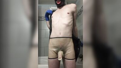 Rubber Boy Jerking Off in Sheath Shorts