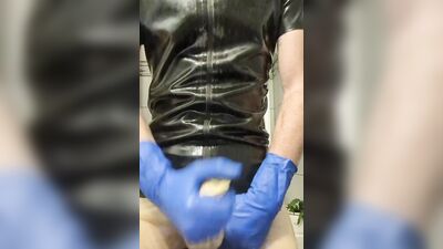 Rubber Boy Jerking Off in Sheath Shorts