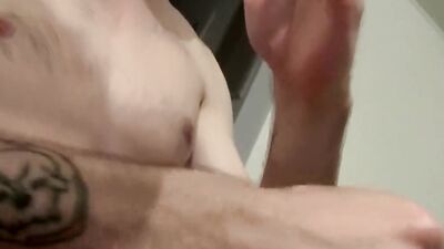 Amateur bloke is smoking a cigarette and jerking his cock