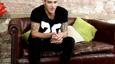 Young jock Mickey Taylor shows off tattoos before wanking