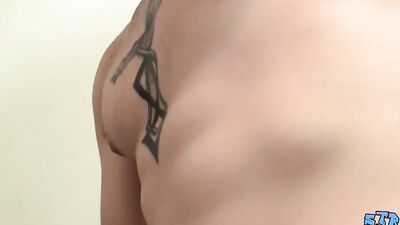 Inked naked thug plays with his giant dick and cums solo