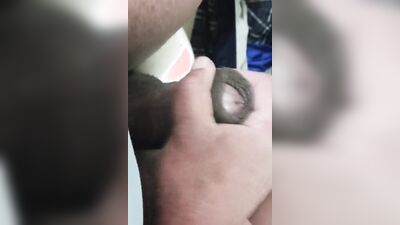 In the bathroom masturbating