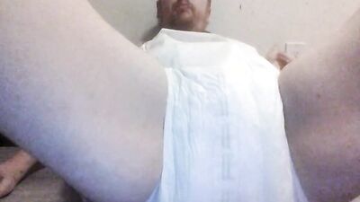 Chubby diaper boy wets diaper and cums