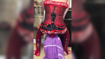 Crossdresser in corsage with mini skirt and latex stockings + fishnet stretches the anal pussy to the maximum with huge plugs