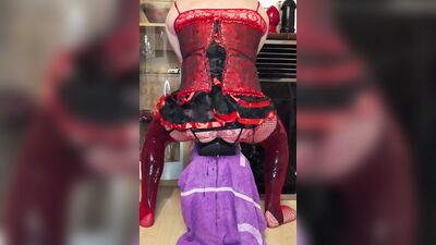 Crossdresser in corsage with mini skirt and latex stockings + fishnet stretches the anal pussy to the maximum with huge plugs