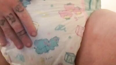 Chubby diaper boy pleases himself