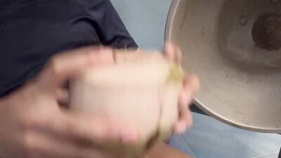 Thai guy make coconut milk.