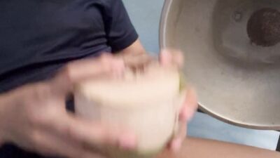Thai guy make coconut milk.