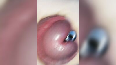Sounding with a close up cum load through penis plug