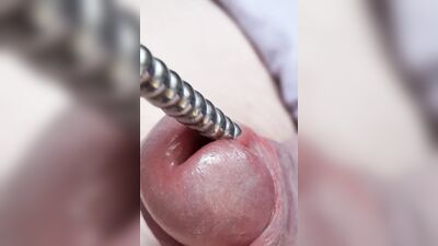 Sounding with a close up cum load through penis plug