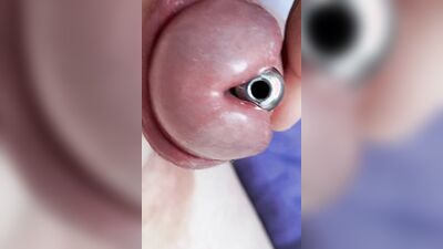 Sounding with a close up cum load through penis plug