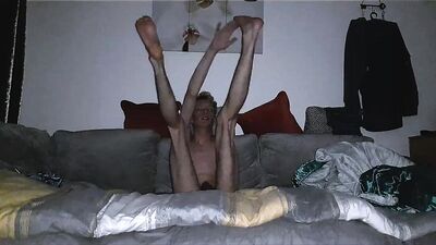Skinny Blonde hair twig shows off his body in his jeans and tests out his flexibility