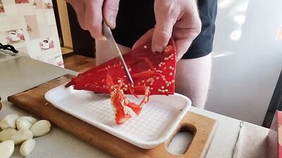 Guy with locked cock is in the kitchen