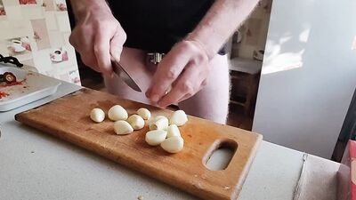 Guy with locked cock is in the kitchen