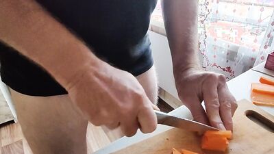 Guy with locked cock is in the kitchen