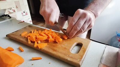 Guy with locked cock is in the kitchen