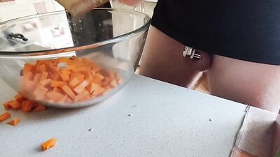 Guy with locked cock is in the kitchen