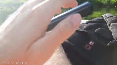 Guy on a boat in the wild masturbates dick and cums powerfully