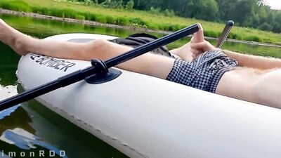 Guy on a boat in the wild masturbates dick and cums powerfully