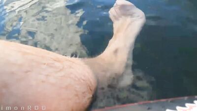 Guy on a boat in the wild masturbates dick and cums powerfully