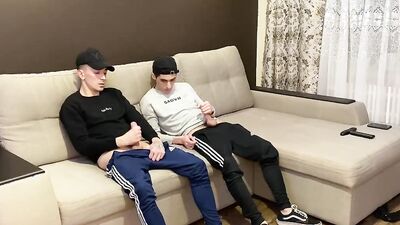 Two friends jerk off in sporwear