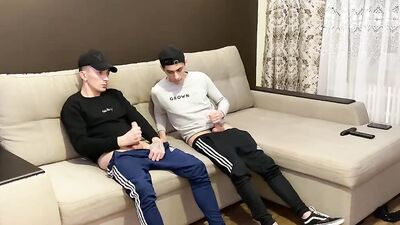 Two friends jerk off in sporwear