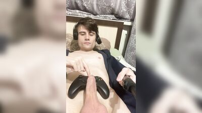 a boy jerks off his penis in a black jacket with different toys, cumming with an eruption of sperm