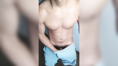 man makes creamy cumshot in shorts