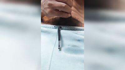 man makes creamy cumshot in shorts